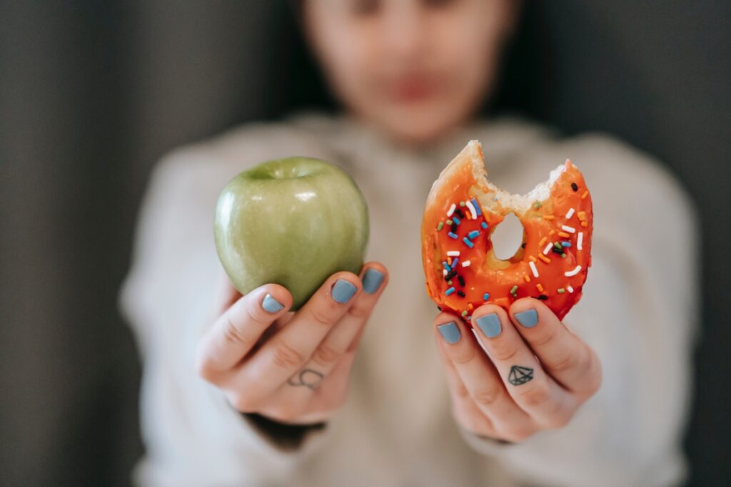 showing an apple and a doughnut