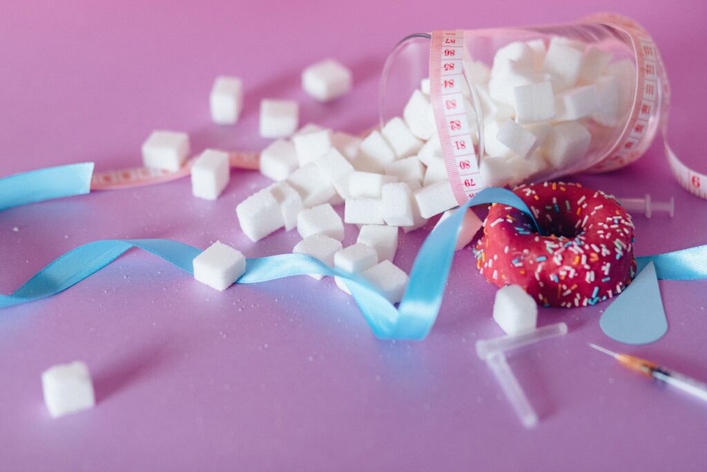 sugar conatiner and measuring tape spread over the table 