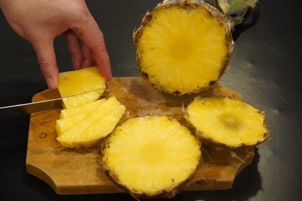 chopping pineapple