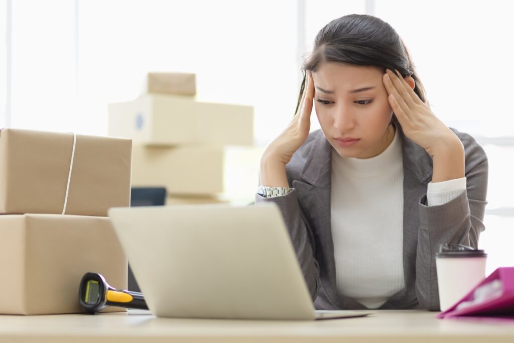 woman worried looking at a laptop