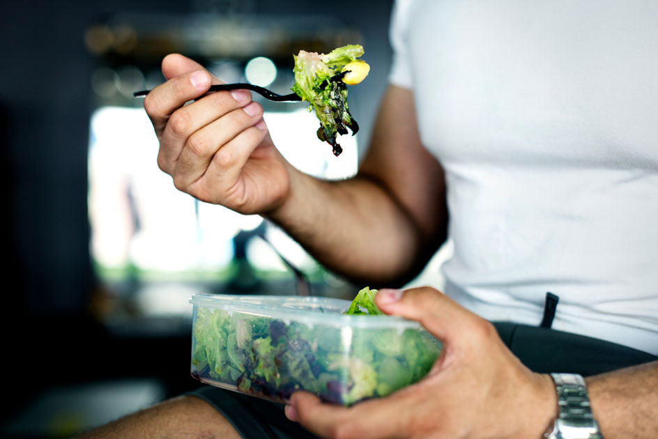 eating salad from container