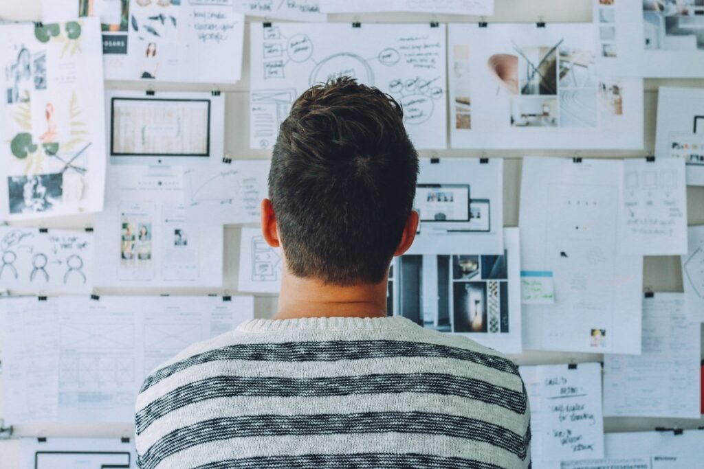 A man viewing concentrated viewing a vision board