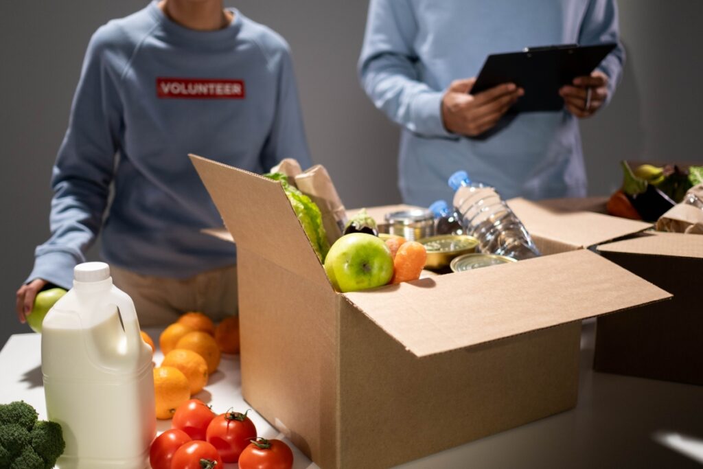 Volunteers helping to pack groceries