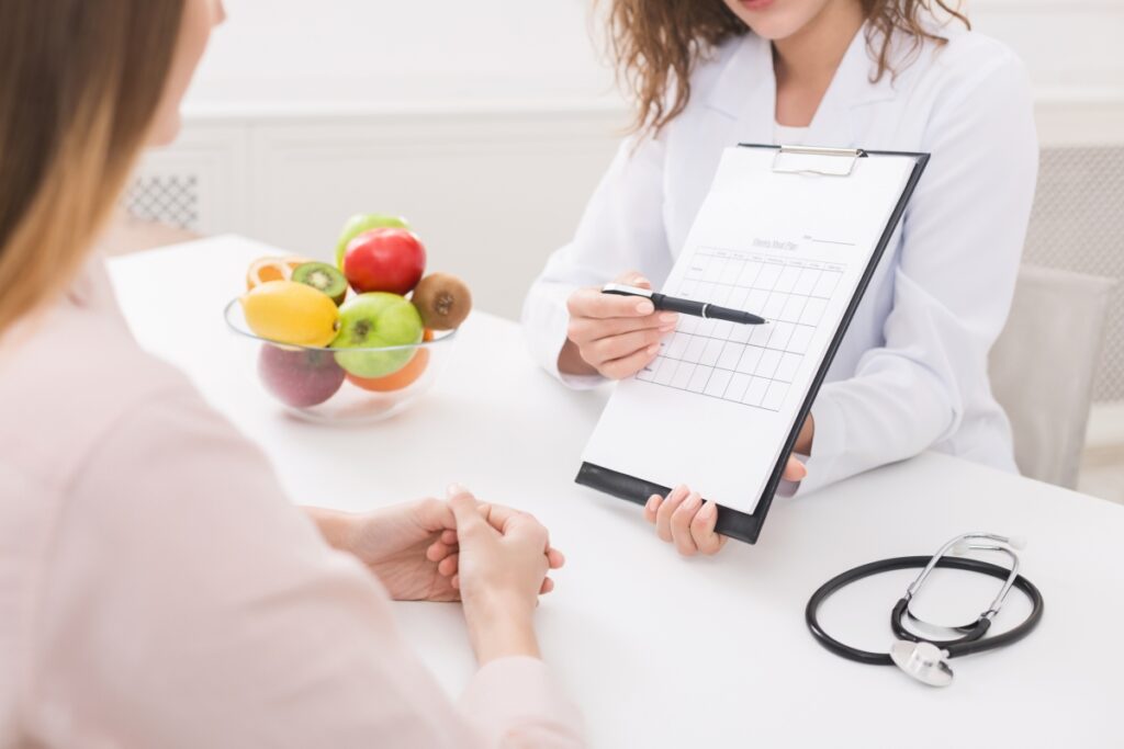 healthcare practitioner explaining a schedule to her patient 