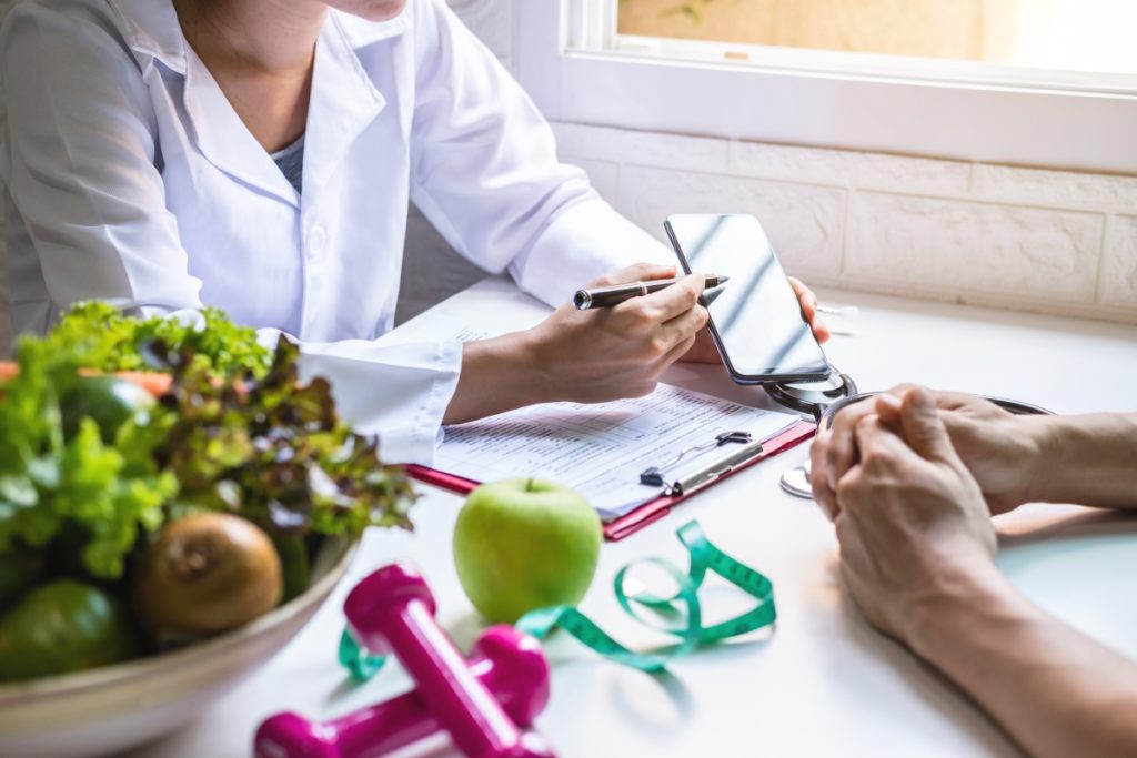 nutritionist giving consultation to a patient with how to start a plant based diet