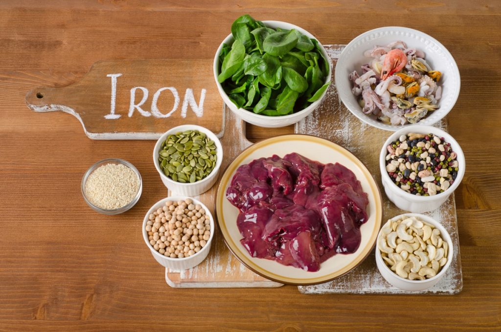 Foods high in Iron on wooden table