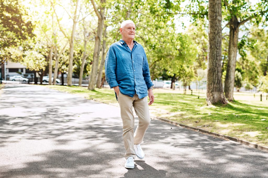 Shot of a senior man spending the day at the park alone after eating