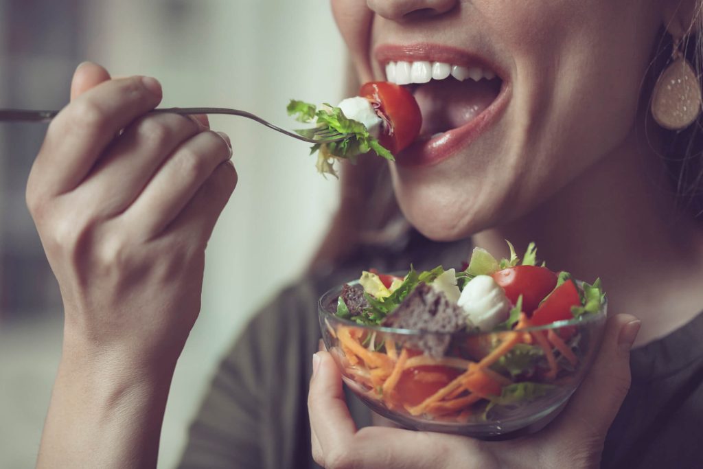 Woman eating a healthy salad