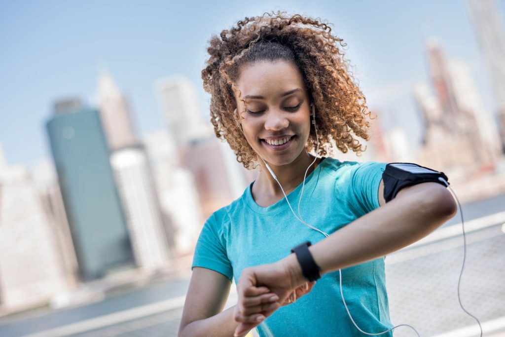 Sportive woman tracking her workout progress