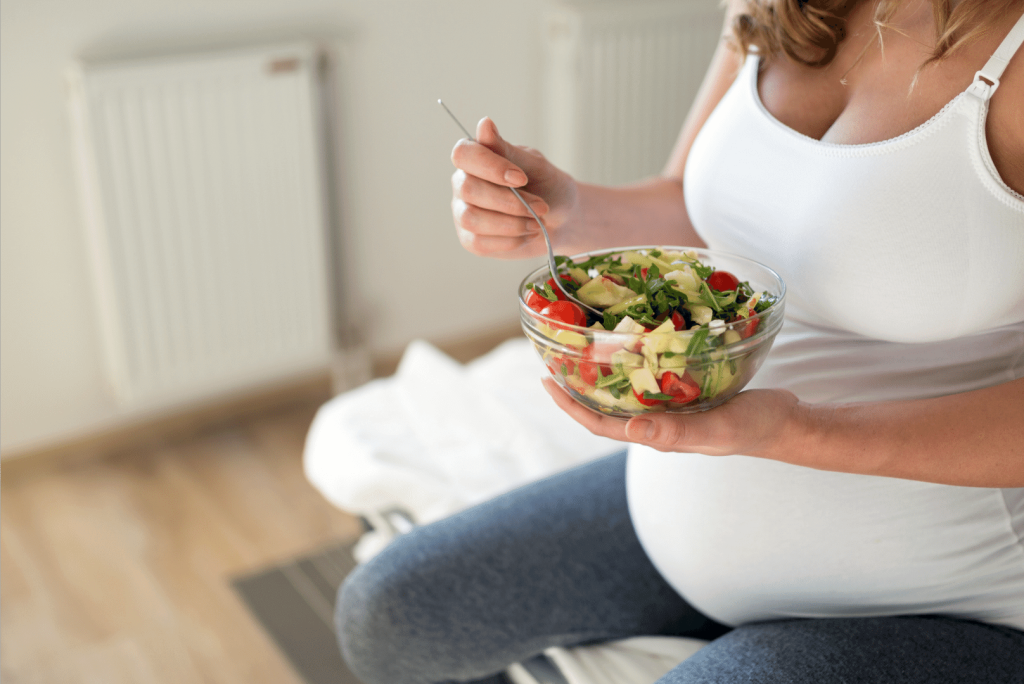 pregnant eating salad
