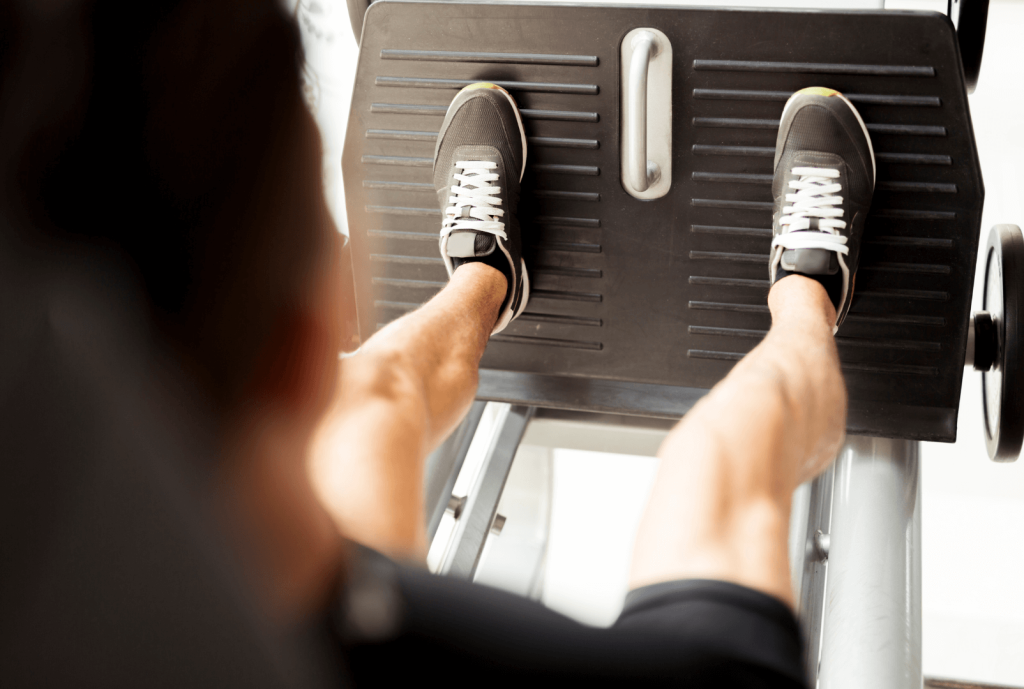 man using leg press