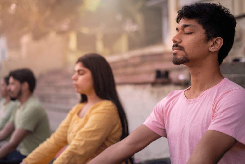 group of people meditating 