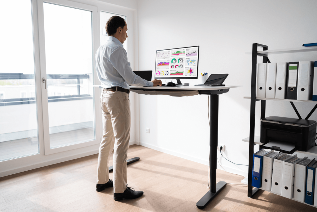 men working with stand up desk