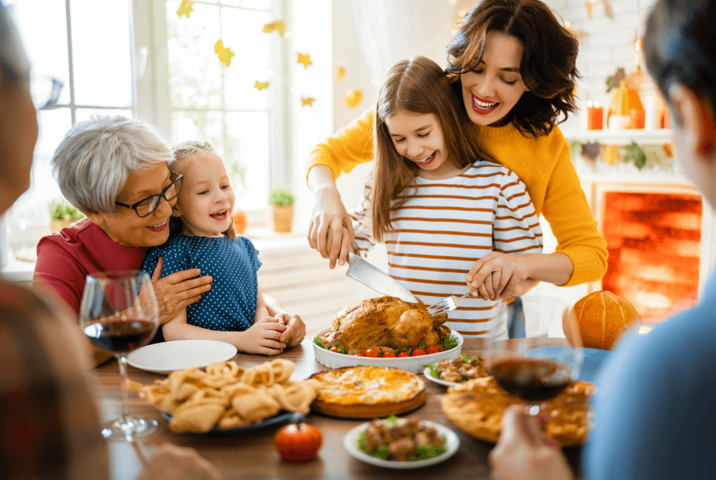 Thanksgiving family dinner, cutting a turkey 