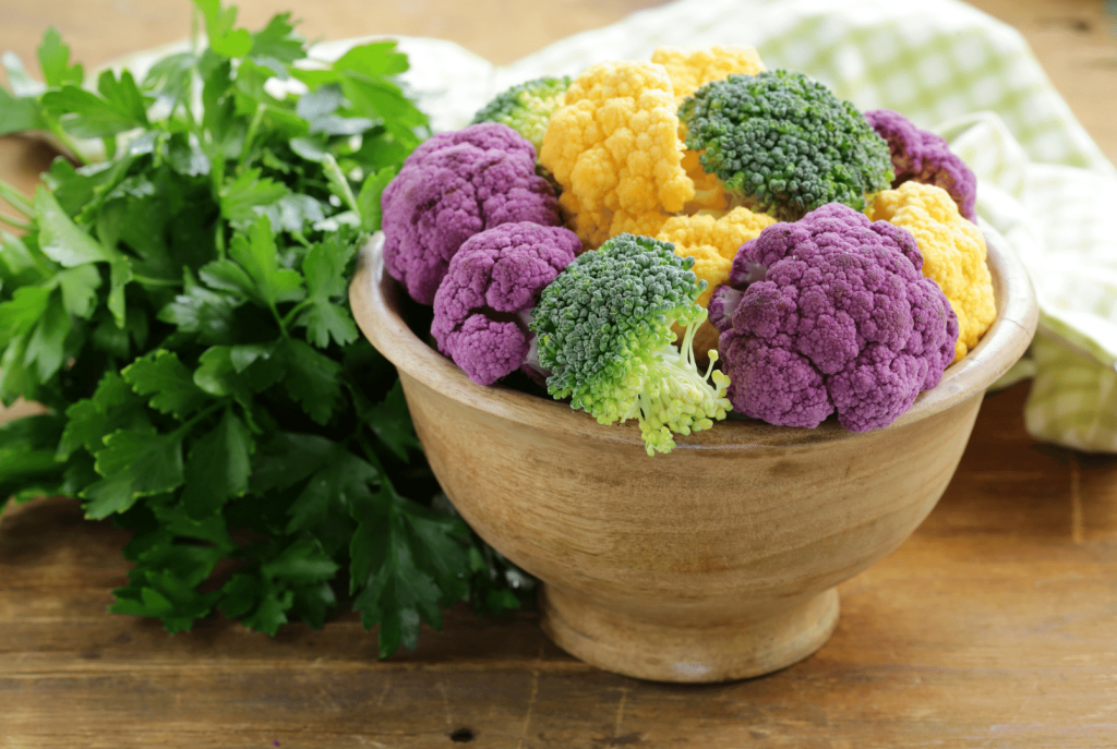 cauliflower red, broccoli, yellow in a bowl with cilantro 