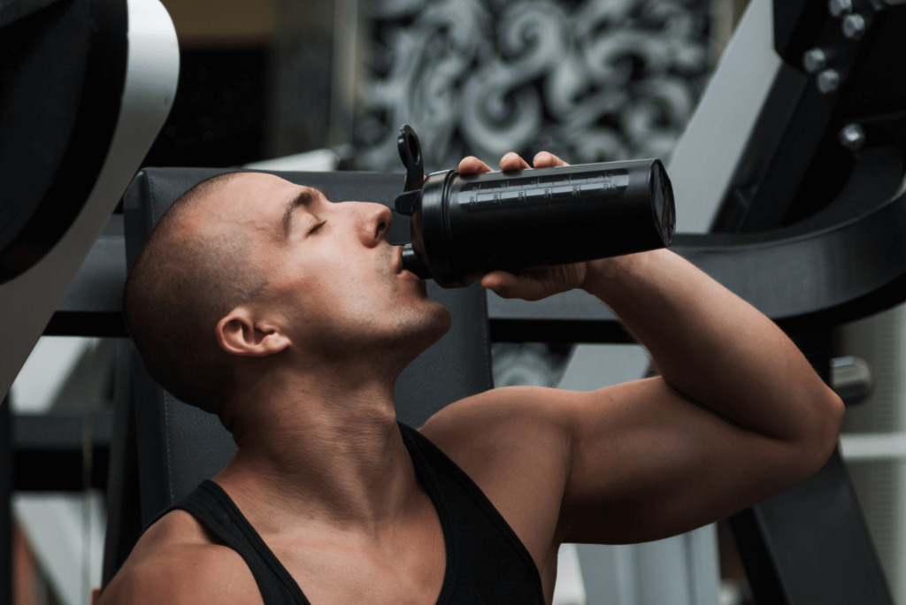 man drinking a protein shake 