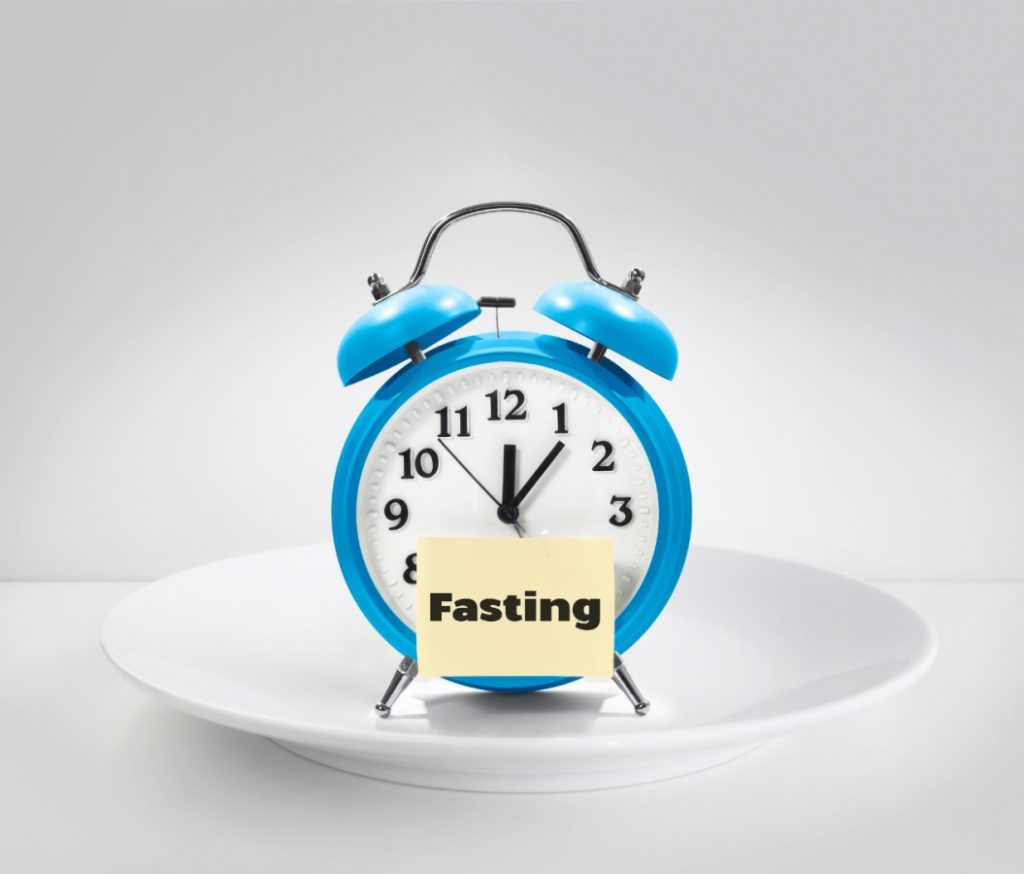 plate with a clock and a fasting sign