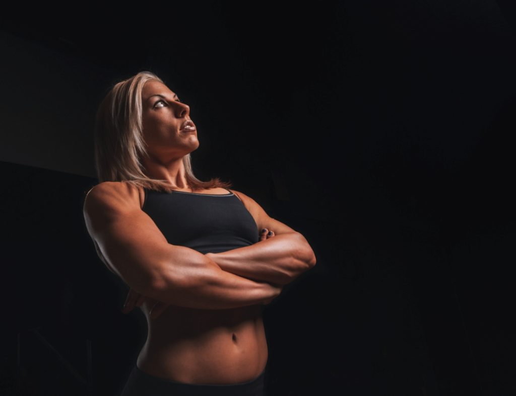 woman bodybuilding on a black background 