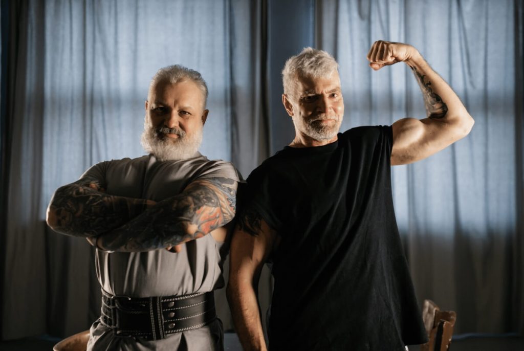 older muscular guys flexing biceps