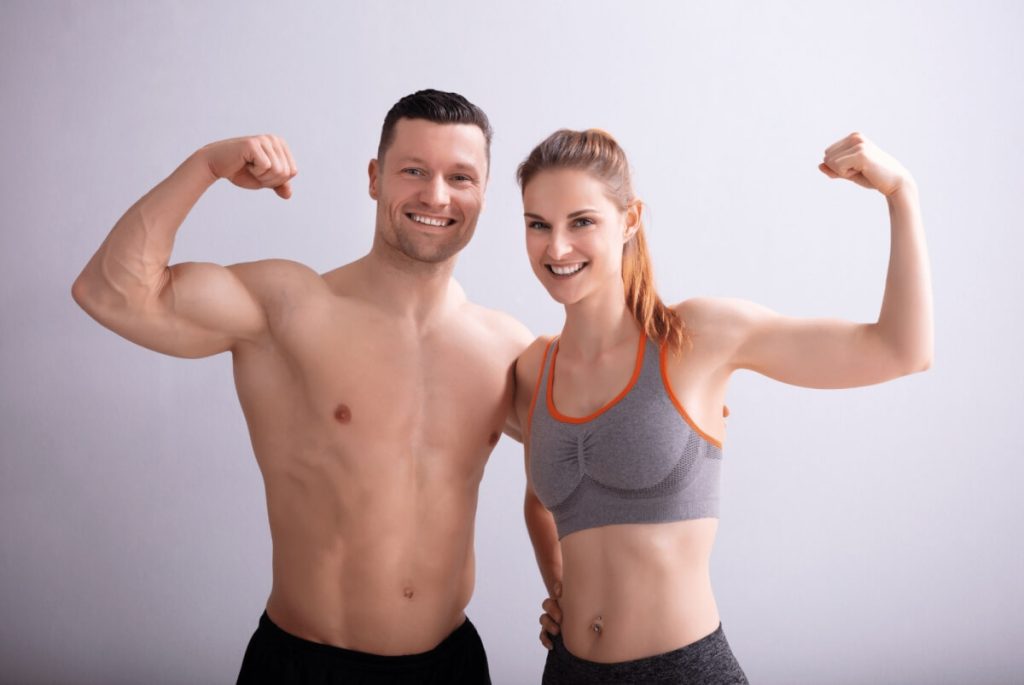 young fit couple posing 