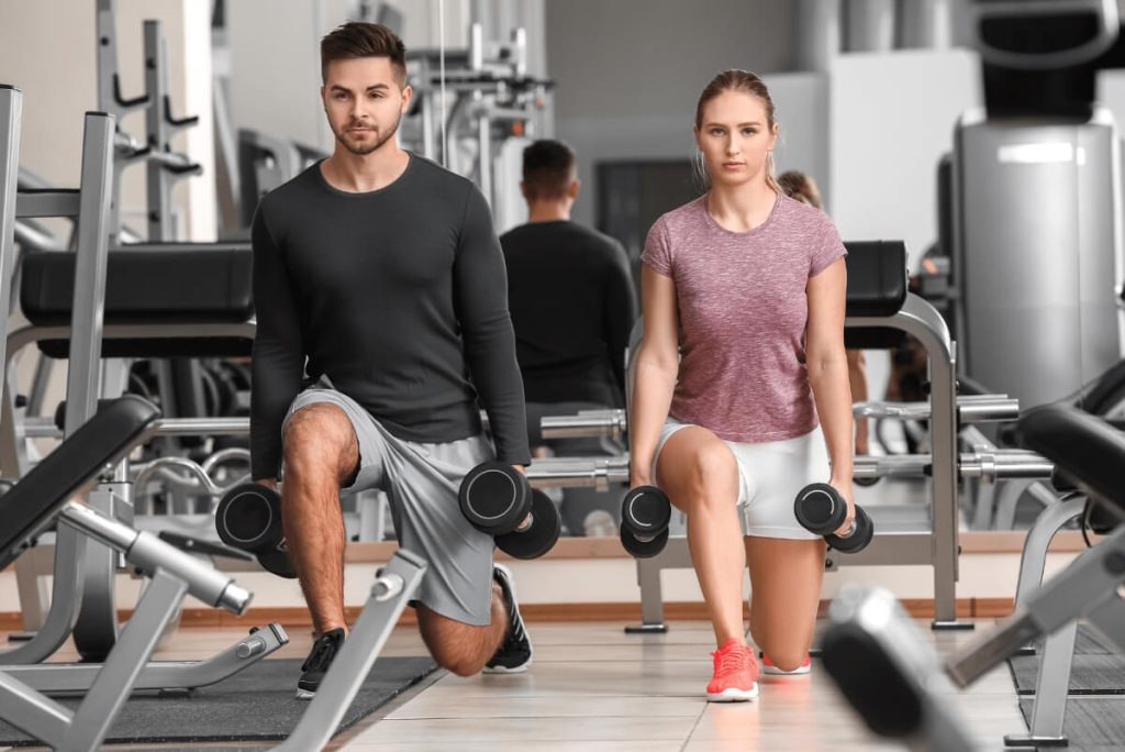 young couple doing lunges 