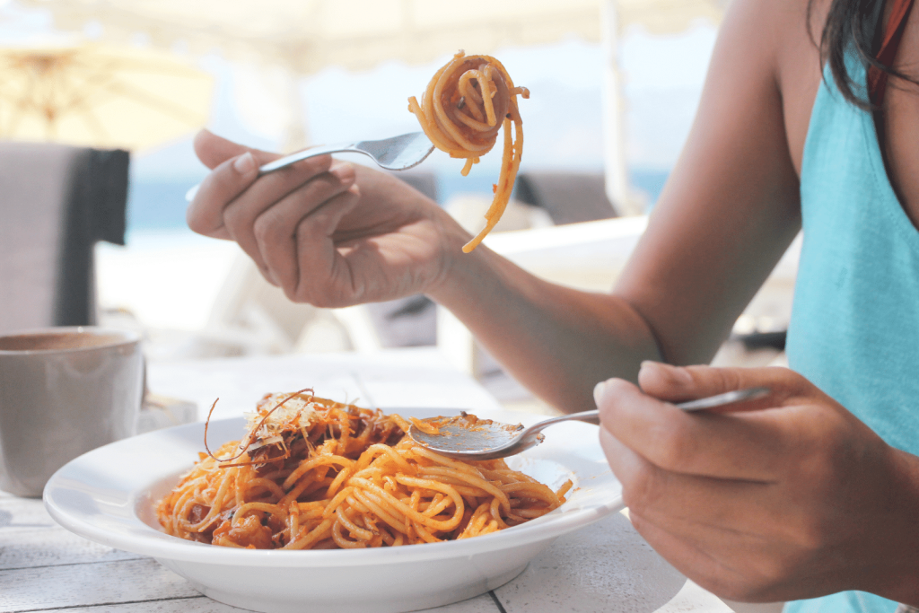 woman eating pasta