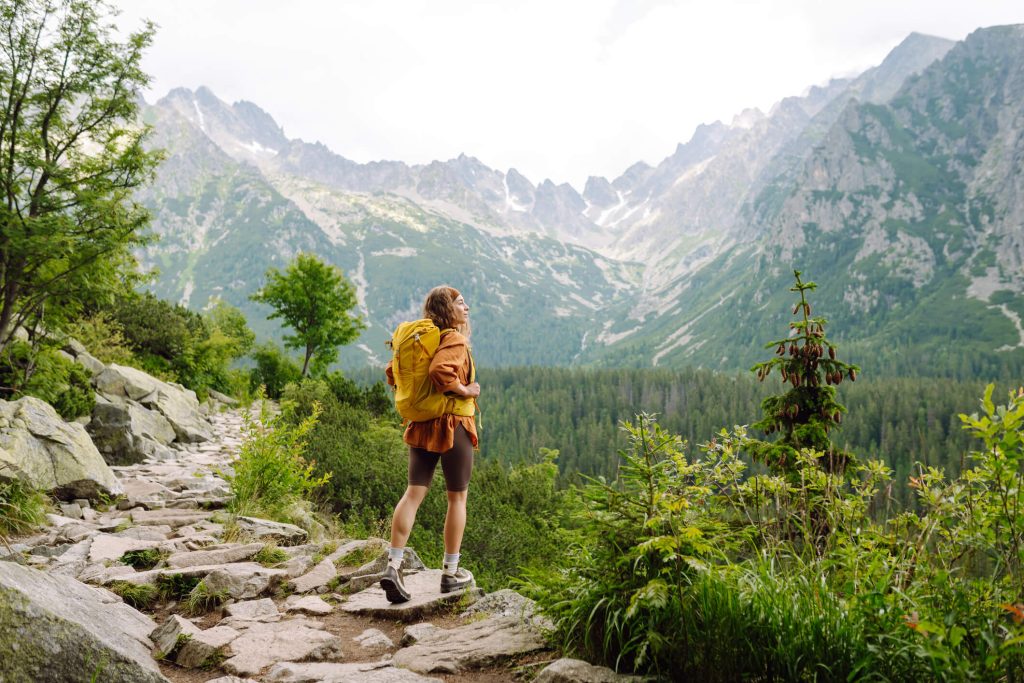 Woman hiking looking at the mountains