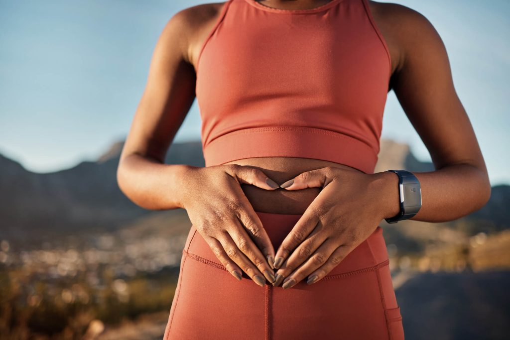 woman touching her belly