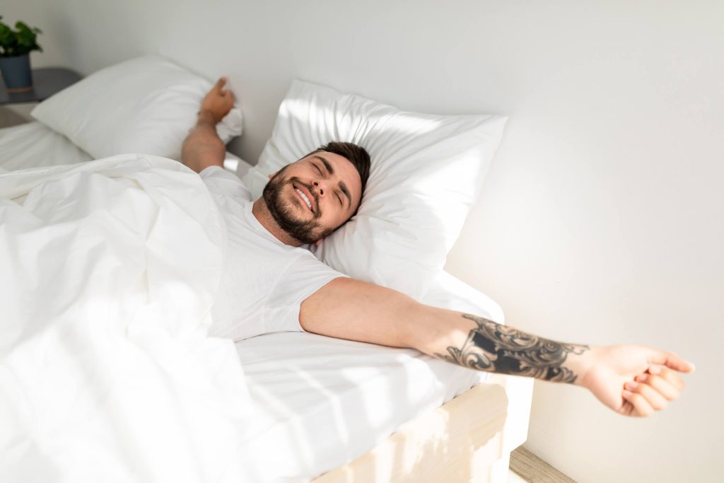 man waking up well rested