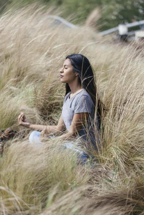 Girl meditating finding balance