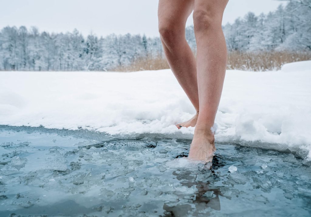 having an outdoor icebath in the snow