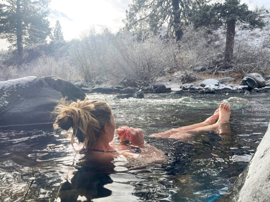 Woman having an outdoor ice bath