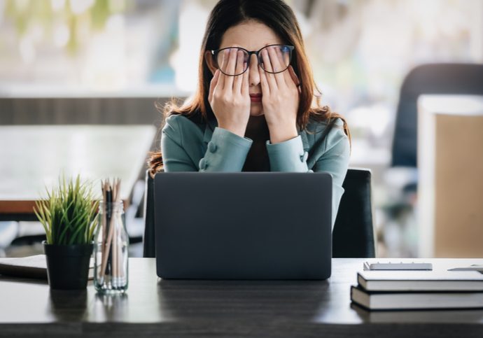 Concept Burnout Syndrome. Business Woman feels uncomfortable working. Which is caused by stress, accumulated from unsuccessful work And less resting body. Consult a specialist psychiatrist