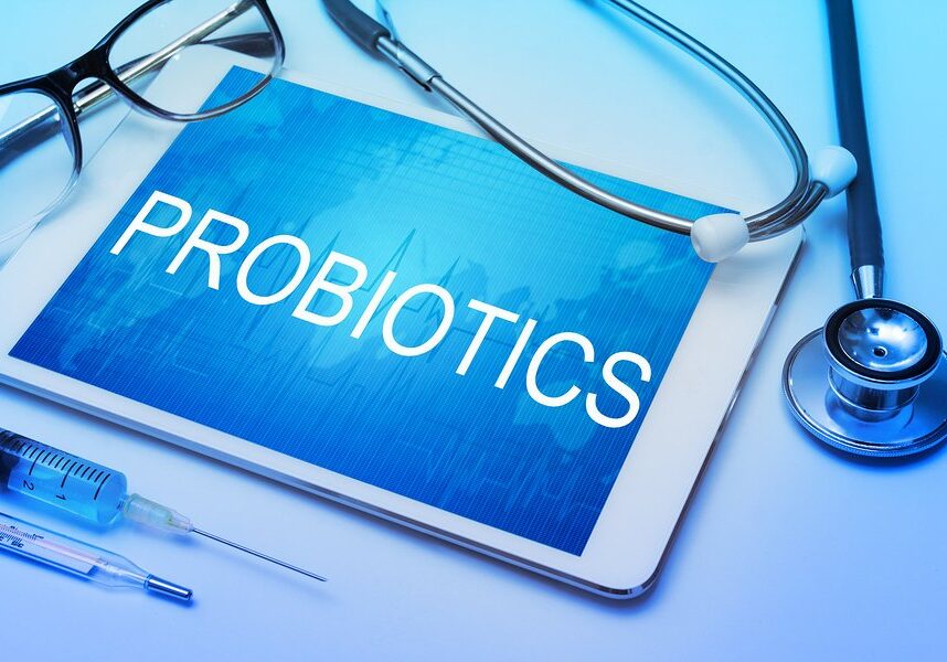 Probiotics word on tablet screen with medical equipment on background