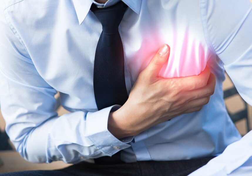 Man in office uniform having heart attack / heart burn