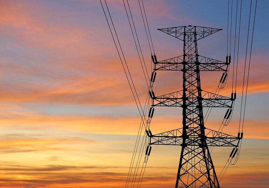 silhouette of high voltage electric tower with beautiful twilight background