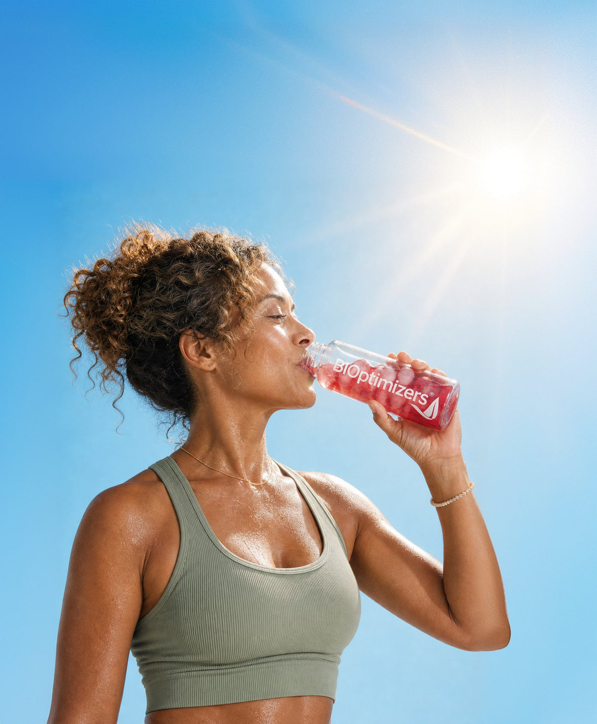 Woman drinking BIOptimizers Electrolyte Breakthrough