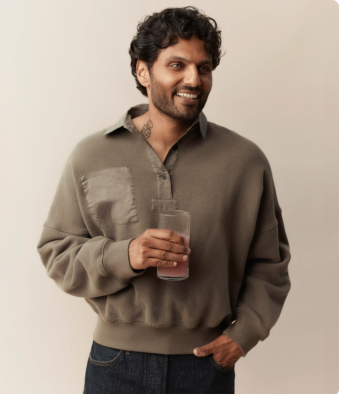 Jay Shetty holding a glass
